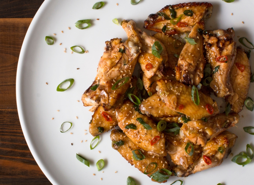Oven roasted chicken wings with oyster sauce, sesame oil, garlic, scallions, and sesame seeds hr-9889